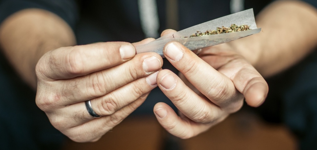  Person Rolling a Joint